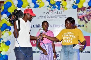 Inspiring voices: A visually impaired student from Idia College shares their story during the 2024 Children's Day celebration.