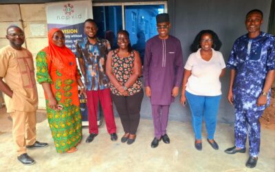 NAPVID & SONKE Team NAPVID staff and SONKE representatives pose for a group photograph outside the organisation’s secretariat in Benin City, Edo State, in front of a NAPVID banner.